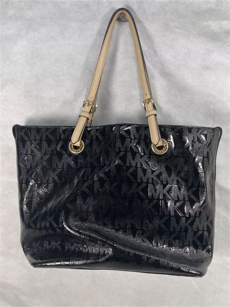 michael kors white with black writing|Michael Kors black shiny purse.